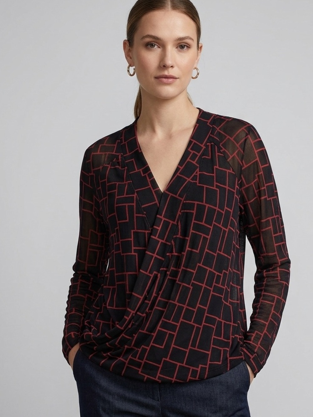 Ricki's Black Long Sleeve Surplice Top with Red Geometric Print